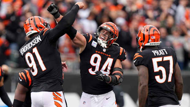 Cincinnati Bengals defensive end Trey Hendrickson (91) and Cincinnati Bengals defensive end Sam Hubbard (94) celebrate a sack in the fourth quarter during an NFL football game between the Seattle Seahawks and the Cincinnati Bengals Sunday, Oct. 15, 2023, at Paycor Stadium in Cincinnati. The Cincinnati Bengals won, 17-13.